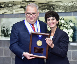 Mary A. Papazian, President of Southern Connecticut State University, at right, awards the SCSU President's Medal of Honor to Rouben Mirzakhanyan, Thursday, September 10, 2015, at a reception at the John Lyman Performing Arts Center Lobby Gallery at SCSU. Mirzakhanyan is rector at Armenian State Pedagogical University After Khachatur Abovyan in Yerevan, Armenia. The presentation was held during the opening for an photography exhibit, "Bearing Witness to the Lost History of An Armenian Family:Through the Lens of the Dildilian Brothers presented by Armen T. Marsoobian, professor and chair of philosphy at SCSU and editor of the journal Metaphilosophy. (Catherine Avalone/New Haven Register)