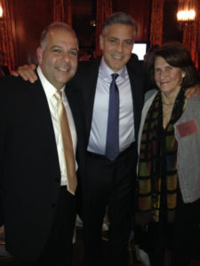 Armenian Assembly of America Board of Trustees Co-Chairman Anthony Barsamian and Board President Carolyn Mugar with George Clooney in New York City at the launch of the 100 Lives initiative for human rights